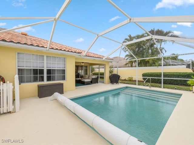 view of swimming pool with glass enclosure, an outdoor living space, a patio area, and a grill