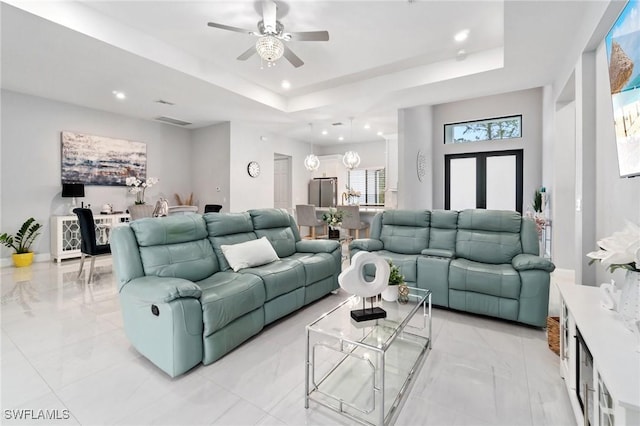 1114 Clayton Ave, Lehigh Acres, FL 33972 - living room with a tray ceiling and ceiling fan