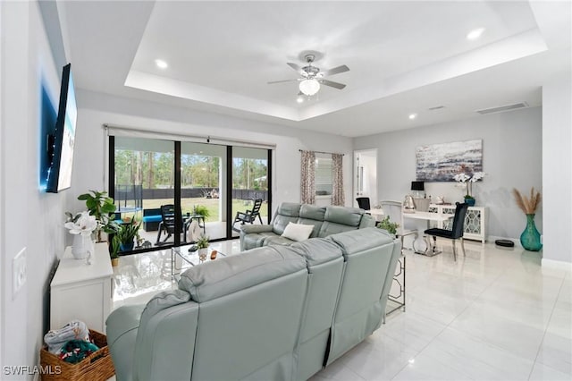 1114 Clayton Ave, Lehigh Acres, FL 33972 - living room with ceiling fan and a raised ceiling