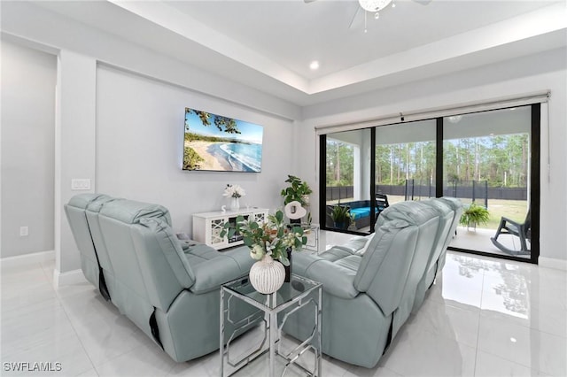 1114 Clayton Ave, Lehigh Acres, FL 33972 - living room with a raised ceiling and light tile patterned floors