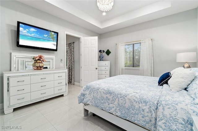 1114 Clayton Ave, Lehigh Acres, FL 33972 - bedroom featuring an inviting chandelier and a tray ceiling