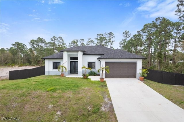 view of front facade featuring a garage and a front yard