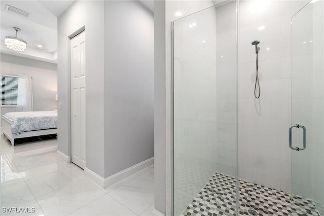 bathroom with a shower with door