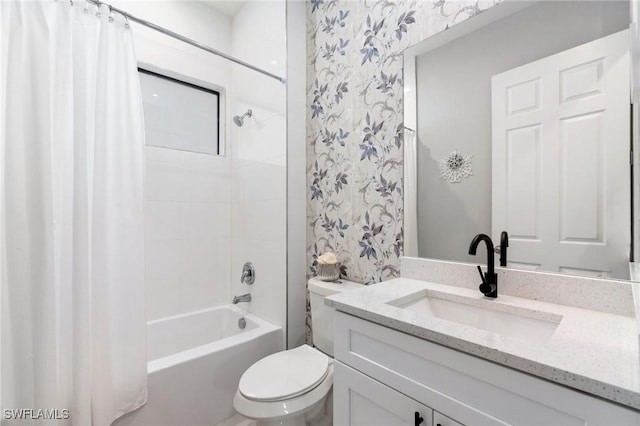 full bathroom featuring shower / bathtub combination with curtain, vanity, and toilet