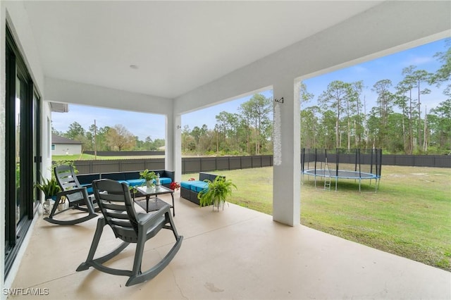 view of patio featuring a trampoline and an outdoor living space