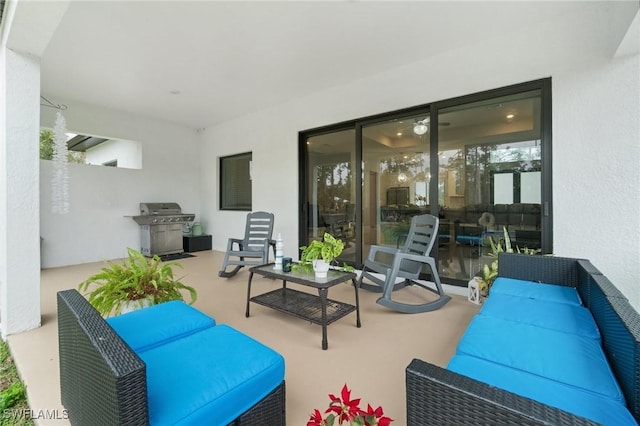 view of patio / terrace featuring a grill, outdoor lounge area, and a balcony