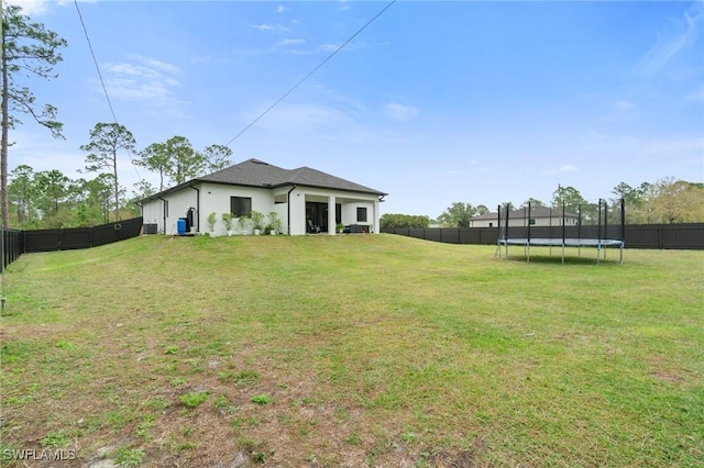 1114 Clayton Ave, Lehigh Acres, FL 33972 - view of yard with a trampoline