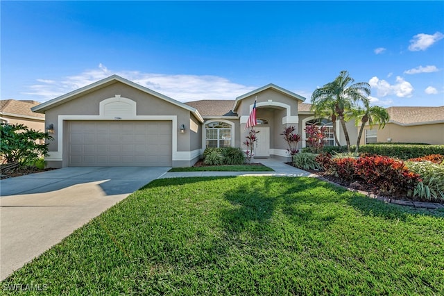 ranch-style home featuring a garage and a front lawn