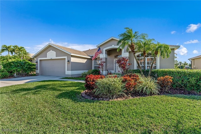 view of front of property with a garage and a front yard