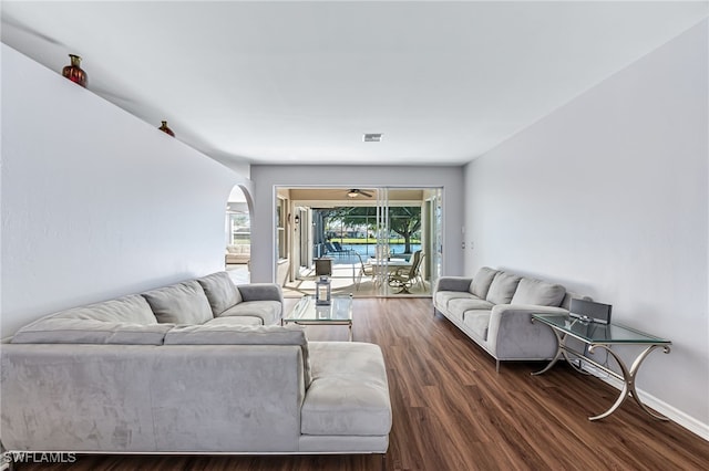 living room with dark hardwood / wood-style flooring