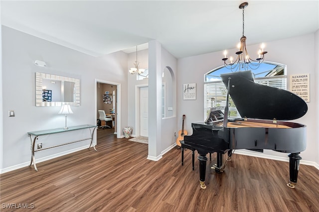 misc room featuring a notable chandelier and wood-type flooring