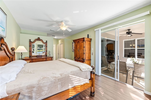 bedroom with ceiling fan, access to outside, and light hardwood / wood-style floors