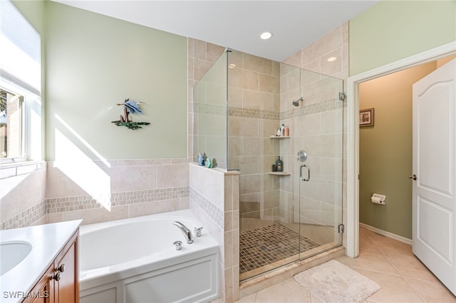 bathroom featuring vanity, tile patterned floors, and separate shower and tub