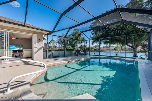 view of pool featuring a water view, a lanai, and a patio area