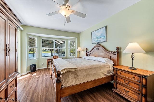 bedroom featuring dark wood-type flooring and ceiling fan