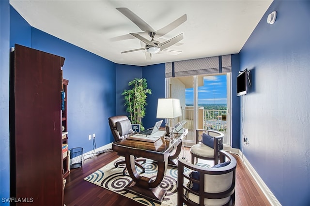 home office featuring ceiling fan and hardwood / wood-style floors