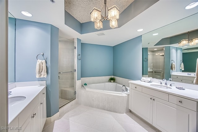 bathroom with independent shower and bath, a chandelier, tile patterned floors, and vanity