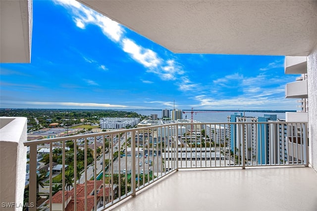 balcony featuring a water view