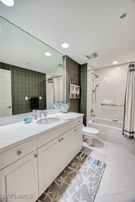 full bathroom with tile patterned flooring, toilet, vanity, and shower / tub combo with curtain