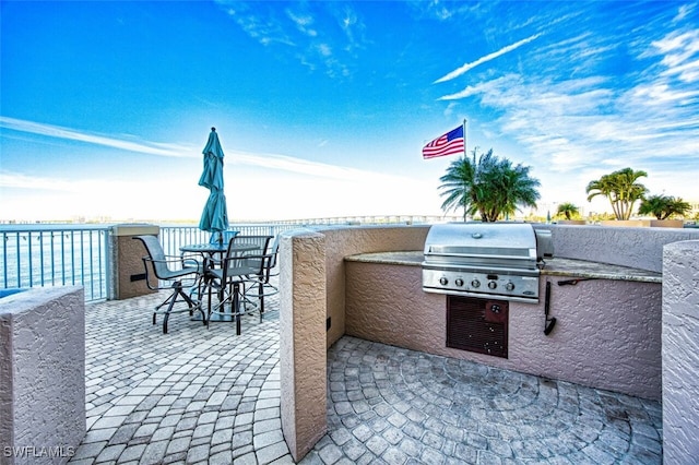 view of patio featuring a grill and an outdoor kitchen