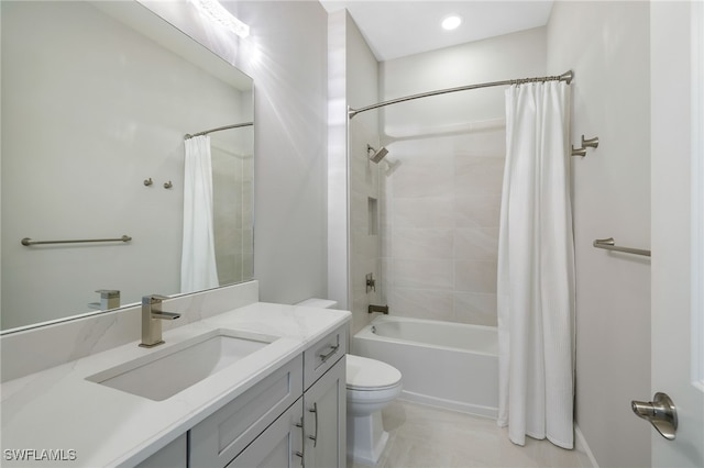 full bathroom featuring toilet, vanity, and shower / bath combo with shower curtain