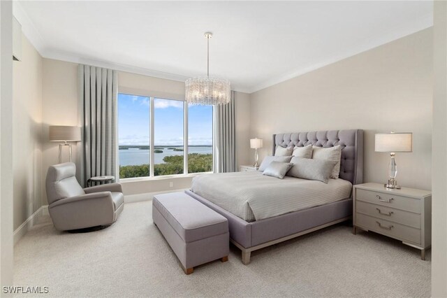 bedroom featuring a water view, light colored carpet, ornamental molding, and a notable chandelier