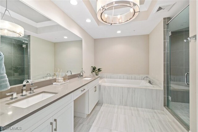 bathroom with vanity and independent shower and bath