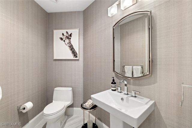 bathroom with sink and toilet