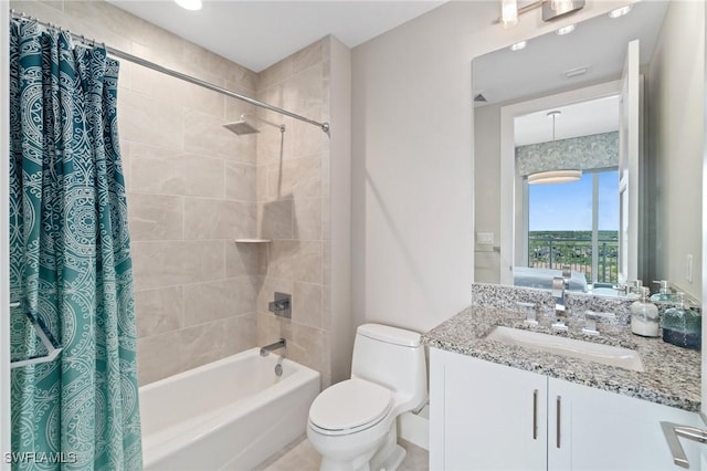 full bathroom with vanity, shower / bath combo with shower curtain, and toilet