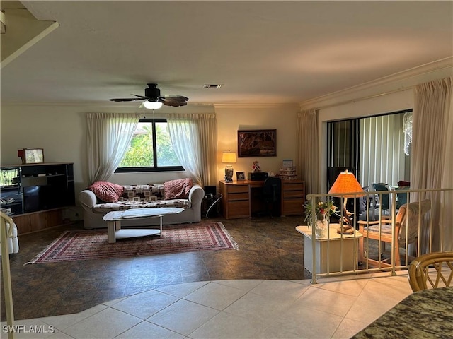 living room with tile patterned flooring, crown molding, and ceiling fan