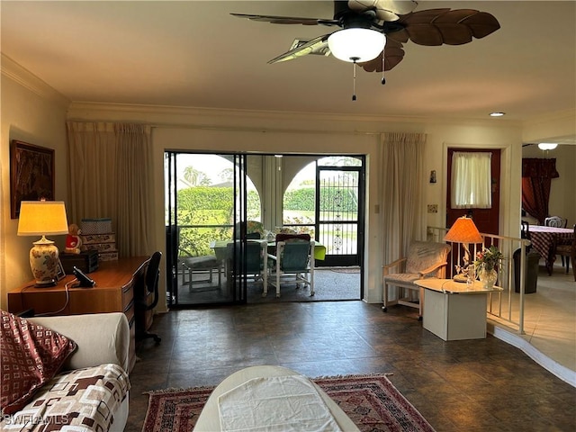 living room with crown molding and ceiling fan