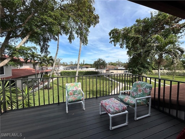 wooden terrace with a yard