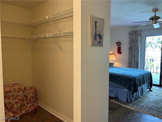 bedroom with ceiling fan and a closet