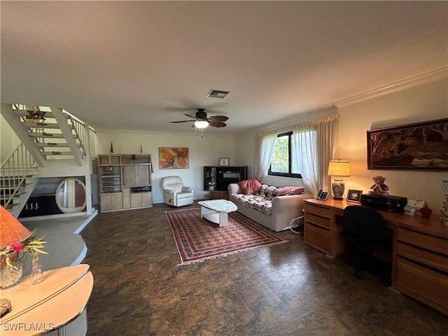 living room featuring ornamental molding and ceiling fan