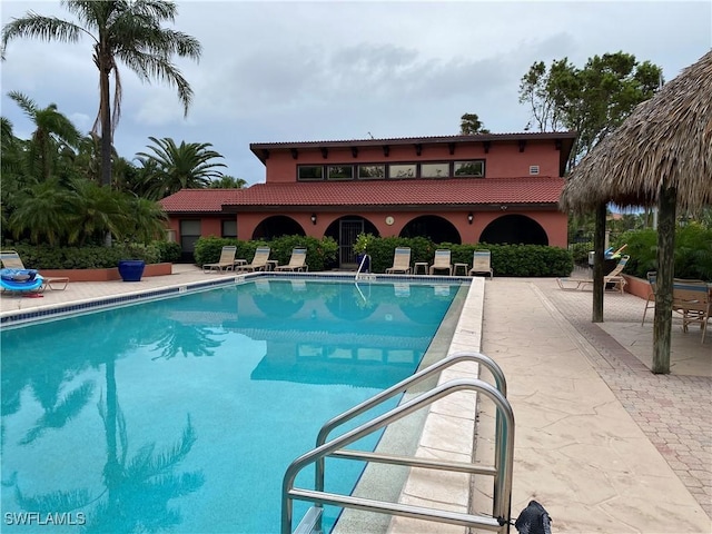 view of swimming pool with a patio area