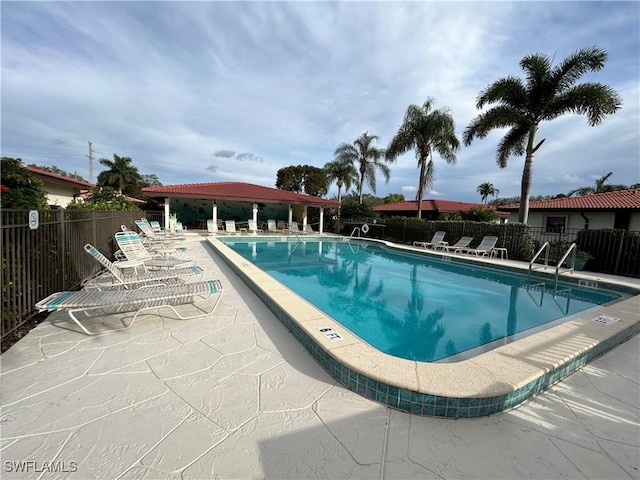 view of swimming pool featuring a patio area