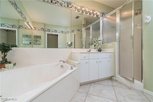 bathroom with independent shower and bath, tile patterned floors, and vanity