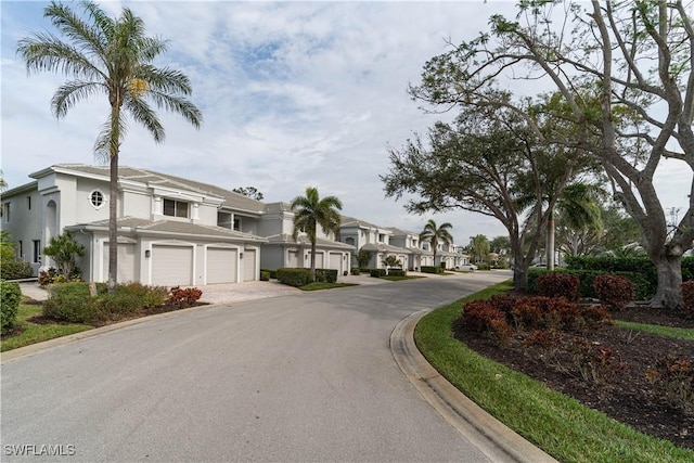 8461 Southbridge Dr Unit 4, Estero, FL 33967 - view of asphalt road featuring curbs and a residential view