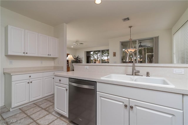 kitchen with sink, dishwasher, white cabinetry, and decorative light fixtures