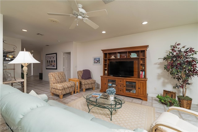 living room featuring ceiling fan and light tile patterned floors