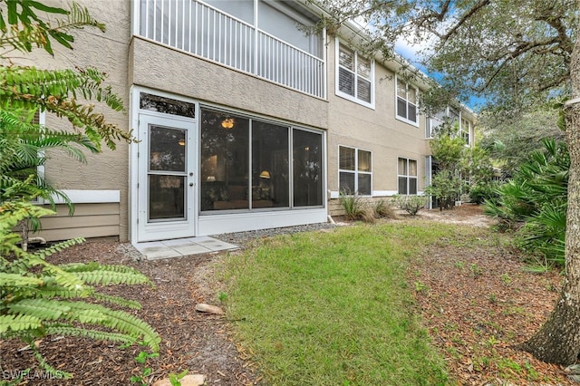 rear view of house with a lawn