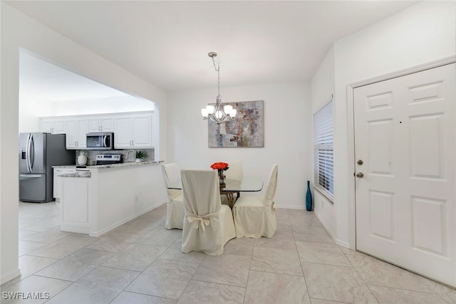 dining area featuring a chandelier