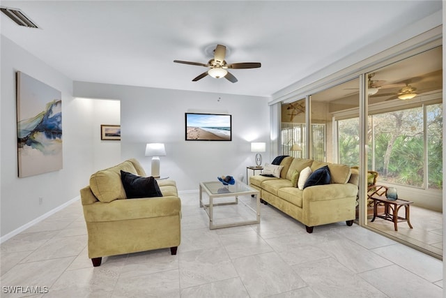 tiled living room featuring ceiling fan