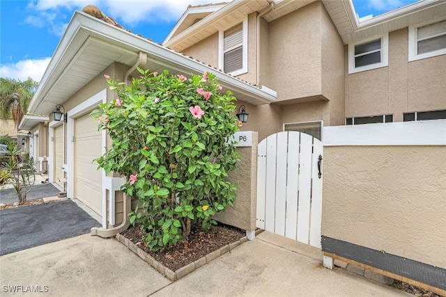 view of side of property featuring a garage