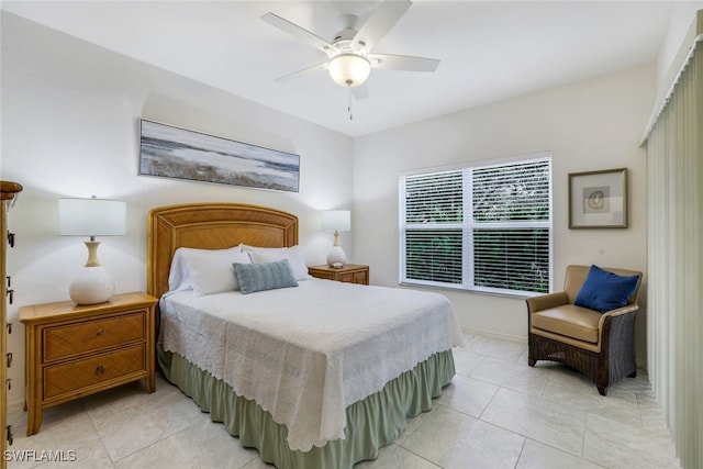 tiled bedroom with ceiling fan