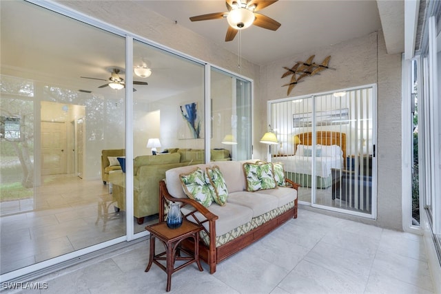 sunroom / solarium with ceiling fan