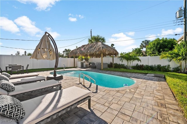 view of swimming pool featuring a patio and a gazebo