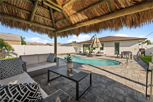 view of pool featuring a patio, a gazebo, and an outdoor hangout area