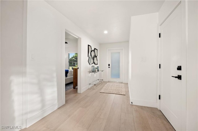 538 106th Ave N, Naples, FL 34108 - corridor with light wood-style flooring, baseboards, and recessed lighting
