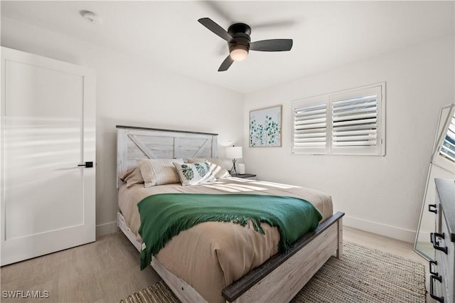 bedroom featuring ceiling fan and light hardwood / wood-style flooring